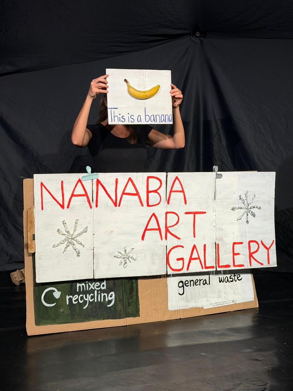 A mock art gallery scene built from waste.